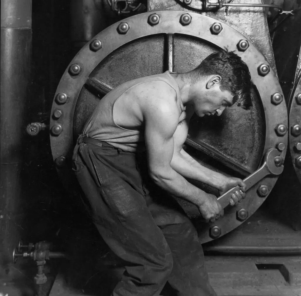 Lewis Hine Power house mechanic working on steam pump 1